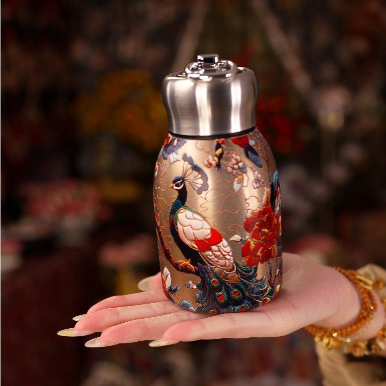 🔥Outdoor portable pocket royal peacock bottle